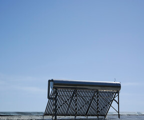 Evacuated tube solar water heater. Water thermal station on the roof. Barrels of water are heated...