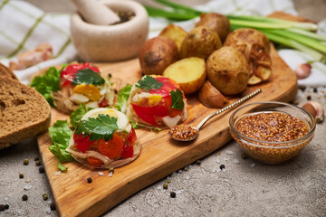 Portion of delicious chicken aspic on serving board on concrete table
