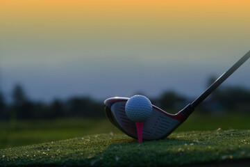 Golf balls on the golf course with golf clubs ready for golf in the first short.