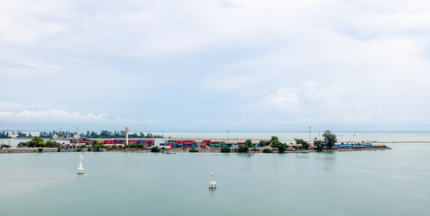 SONGKHLA, Singhanakorn, THAILAND - MAY 7, 2022: Songkhla Terminal Port. Shipping of Container Logistics Industry. Stack of Containers Cargo Ship with rain cloud. Imports and Exports.