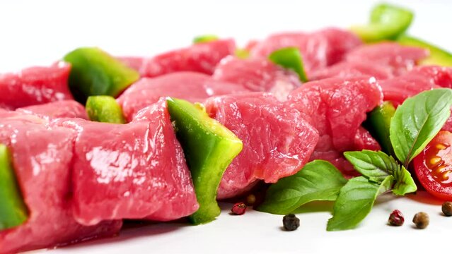 raw beef skewer on white background