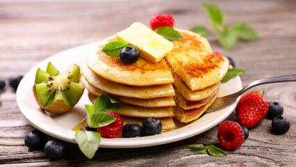 stack of pancakes with berries fruits