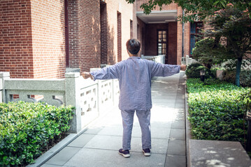 Hospital patient is exercising outdoors