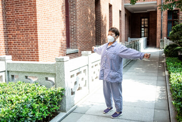 Hospital patient is exercising outdoors