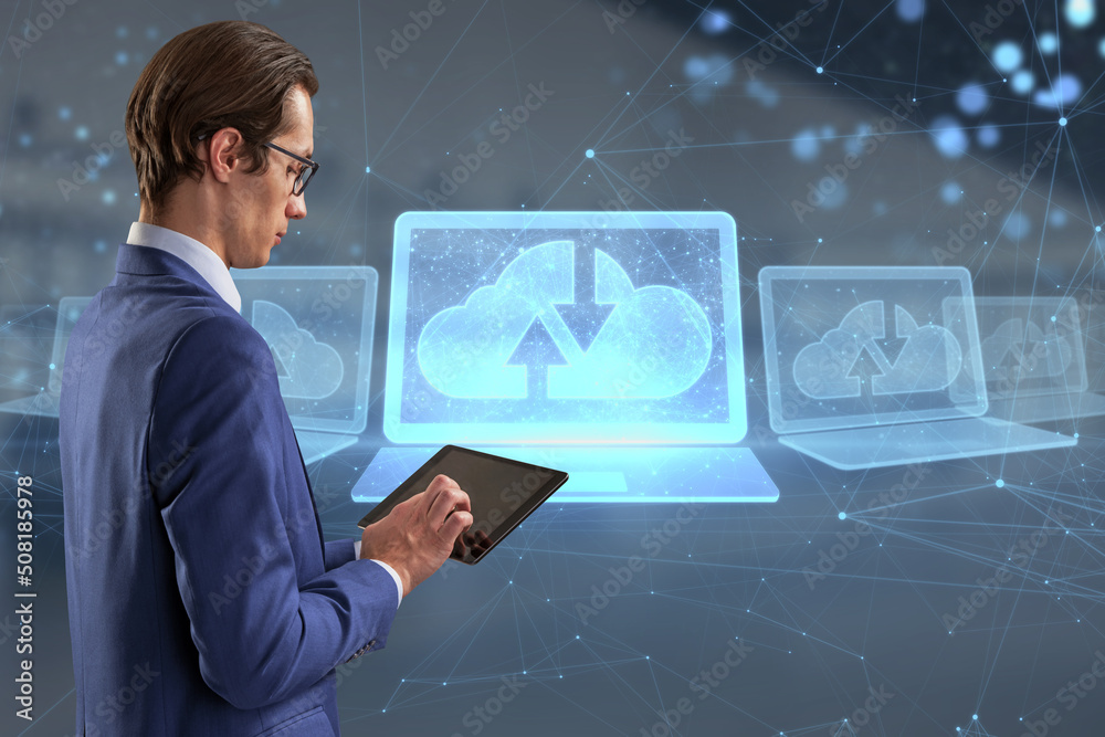 Poster attractive young caucasian businessman with tablet and abstract polygonal digital laptop with cloud 