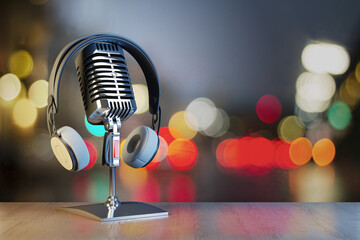 Close up of silver mic and headset on blurry lights bokeh backdrop with mock up place. Podcast and information concept. 3D Rendering.