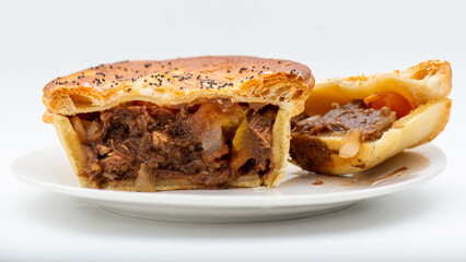 Fresh baked golden flaky chunky tomato and onion flavoured pie