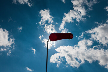 Weaving wind socks in front of blue sky.