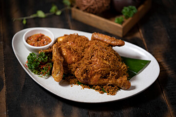 Indonesian Food: Chicken with Fried Coconut Flakes or Ayam Serundeng is an Indonesia popular dish originating from Bandung, West Java.