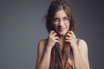 Portrait of young woman with piercing,  dreadlocks and long hair￼