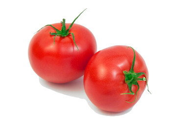 ripe tomatoes on a white background. the concept of cooking tomato sauce. red vegetables on a light texture. juicy pink tomatoes on the table