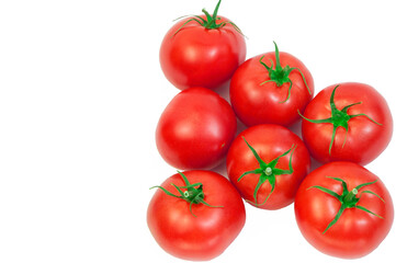 ripe tomatoes on a white background. the concept of cooking tomato sauce. red vegetables on a light texture. juicy pink tomatoes on the table