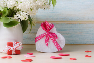 Bouquet of lilacs with heart shaped gift box
