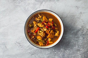 healthy plant-based food, vegetable stew with cauliflower potato broccoli in spicy broth