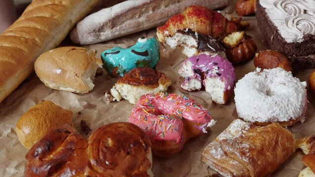 Uneaten sweets, pastries, Fast carbs, flour products and donuts. Food loss and waste