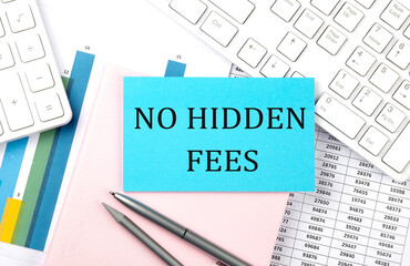 NO HIDDEN FEES text on blue sticker on chart with calculator and keyboard,Business concept