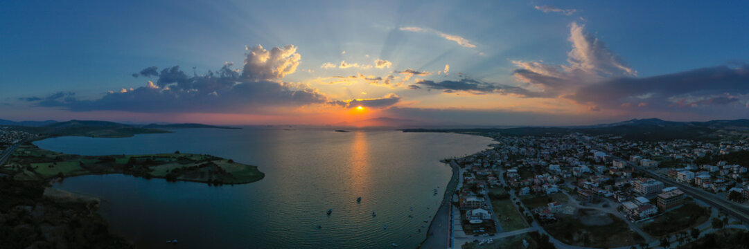 View of the pier and boats at sunset in Izmir, Aliaga, Yenisakran coast.