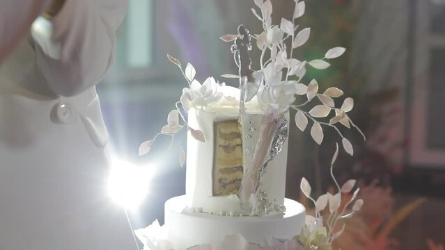 A cut of beautiful wedding cake