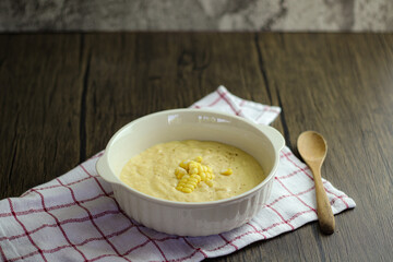 bowl of corn soup with spoon