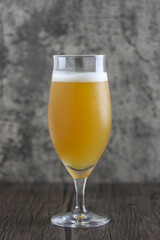 glass of beer on wooden table