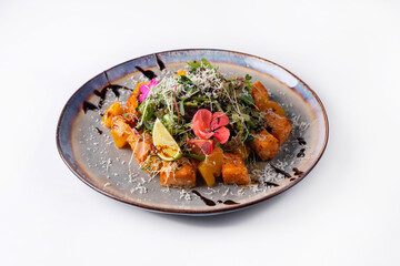 salad of fruits and vegetables with herbs. on a white background