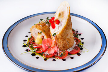 meatloaf with cheese filling and tomatoes. on a white background