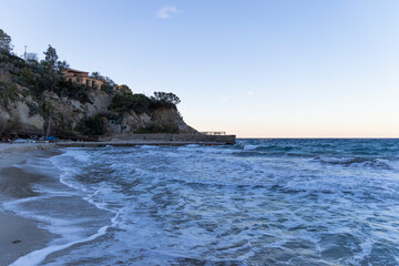 Fototapeta na wymiar Coast and sea near Sant'Andrea on the island of Elba in Italy with blue sky in summer at dusk