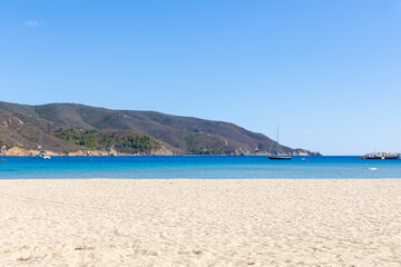 Fototapeta na wymiar beach in in Marina di Campo on the island of Elba in Italy in summer with blue sky