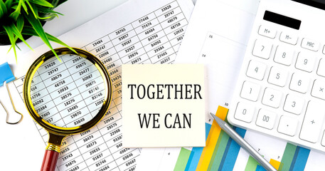 Together We Can text on sticker on diagram with magnifier and calculator. Business concept