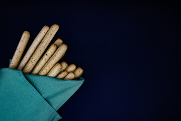 Breadsticks on dark background
