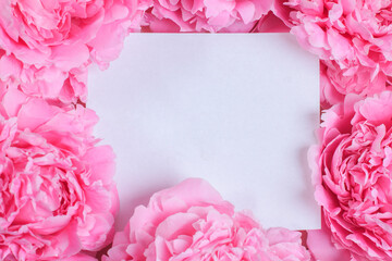 Invitation or greeting card mockup with delicate pink peonies frame and empty blank