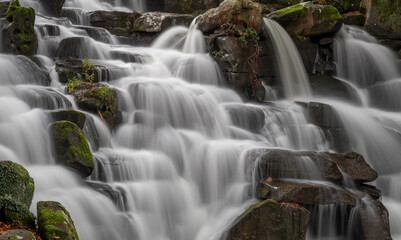 Long Exposure of waterfall running water and wet rocks with motion blur