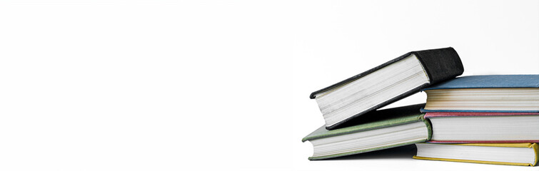 Stack of books on white background with copy space