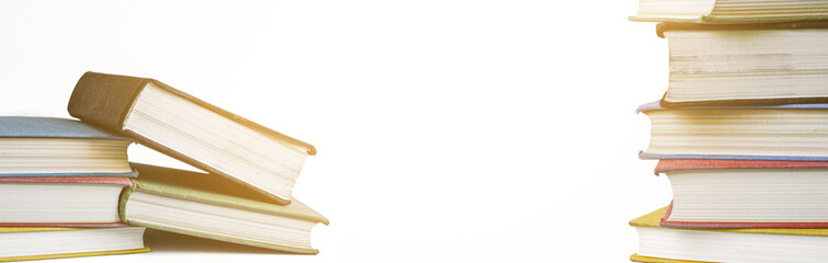 Stack of books on white background with copy space