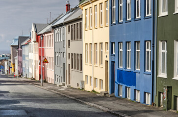 Reykjavik, Iceland, April 25, 2022: street in the old center of town with individual facades painted in various colors