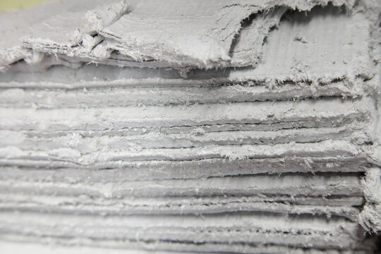 Asbestos sheets in stack -  insulator dangerous to health