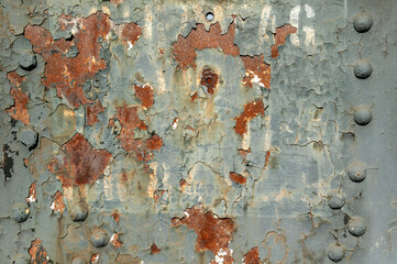 Peeling paint rust texture grunge background of a grey white painted vintage cast iron textured...