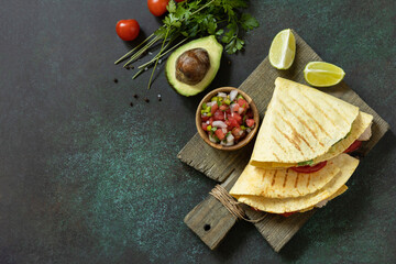 Healthy lunch. Tortilla sandwich, mexican wraps  with grilled chicken fillet and avocado, served...
