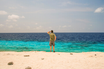 Man looking at horizon at sea