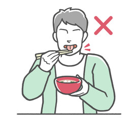 お箸のマナー違反　ねぶり箸をする男性