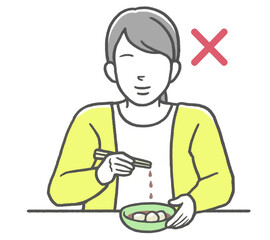 お箸のマナー違反　涙箸をする女性