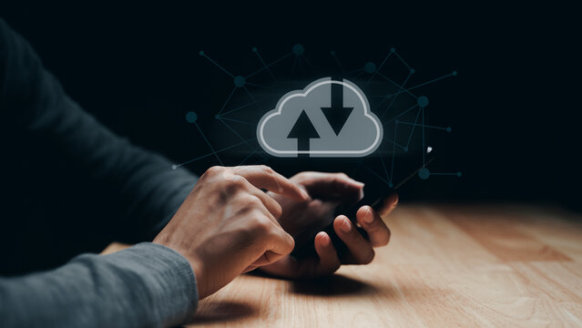 Man using smartphone with virtual cloud computing with connection line.Cloud computing system for sharing download and upload big data information..