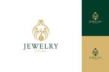 Diamond ring jewelry logo and peacock shape. Symbol of jewelry manufacturing, gold and gem shop. Luxurious and elegant flat concept with several premium color displays