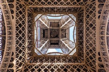 View of the Eiffel tower seen from below in Paris, France. Architecture and monuments of Paris. Paris postcard