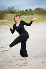 Woman dancing near the sea - 508211346
