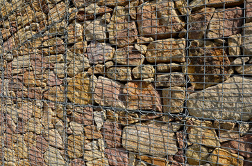 bench without backrest made of metal rods. lattice transparent placed on gypsum cobblestone paving...