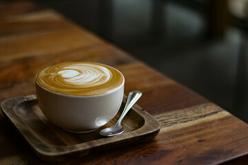cup of coffee on wooden table