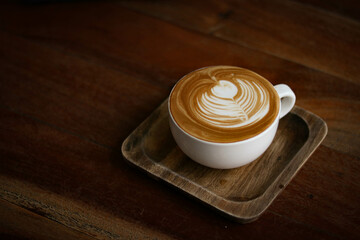 cup of coffee on wooden table