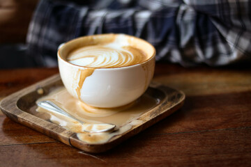 cup of coffee splash on wooden table