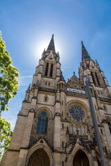 Fototapeta na wymiar St. Maria Church in Stuttgart with sun illuminated behind the tower